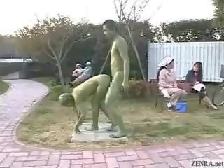 Grön japanska trädgårds statues fan i offentlig